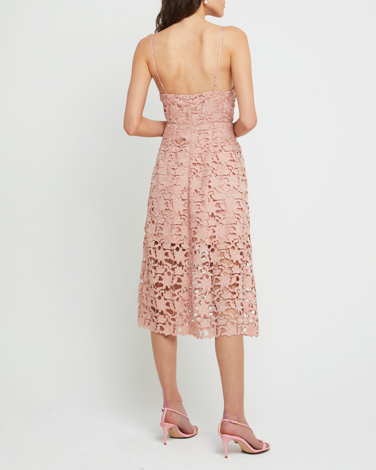 Second image of Arabella Dress, a pink modern lace midi-length bridesmaid dress with deep v-neckline, inner lining, adjustable straps, and a back zipper