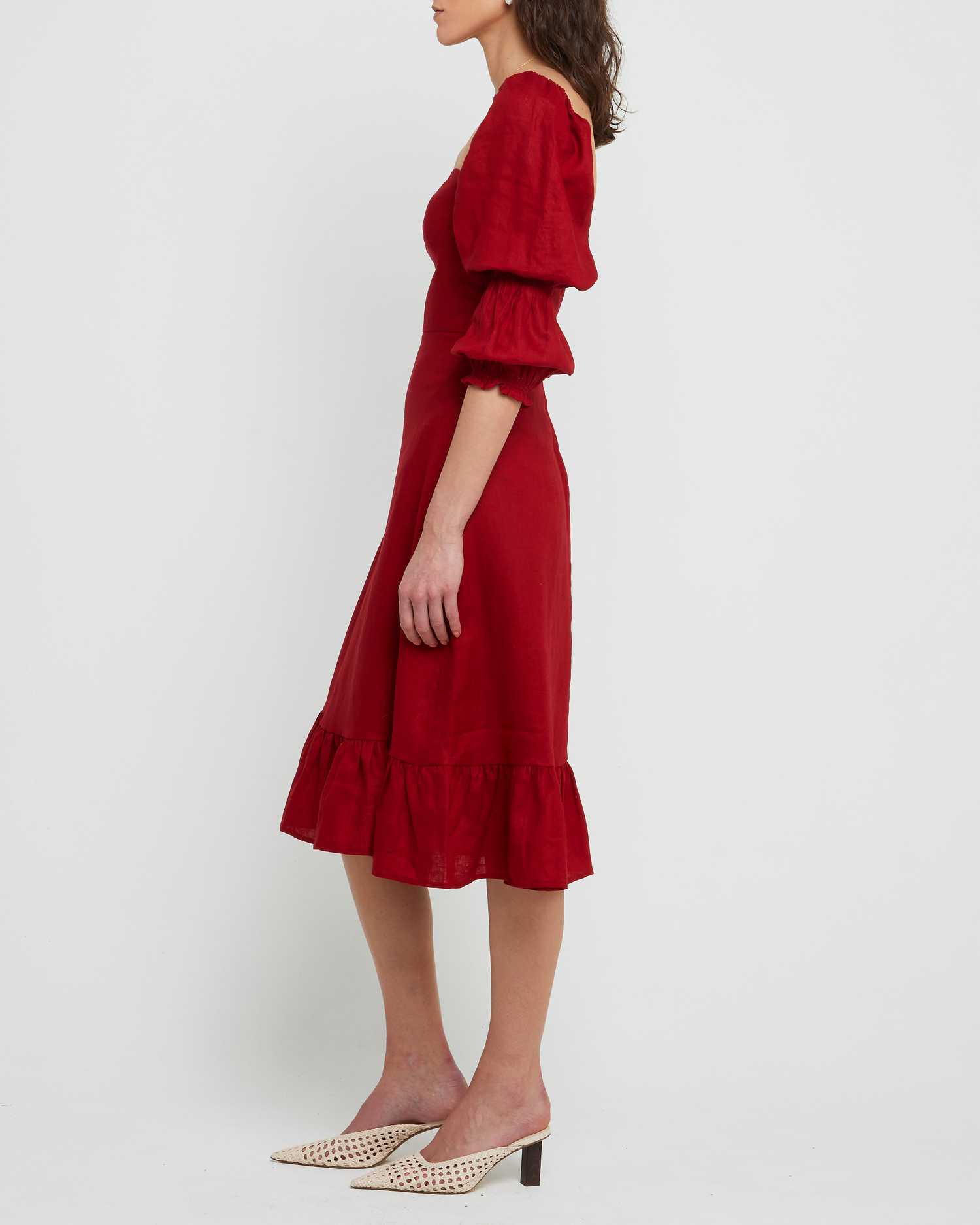 Third image of Kourtney Dress, a red midi dress, puff sleeves, romantic, sweetheart neckline, ruffle skirt