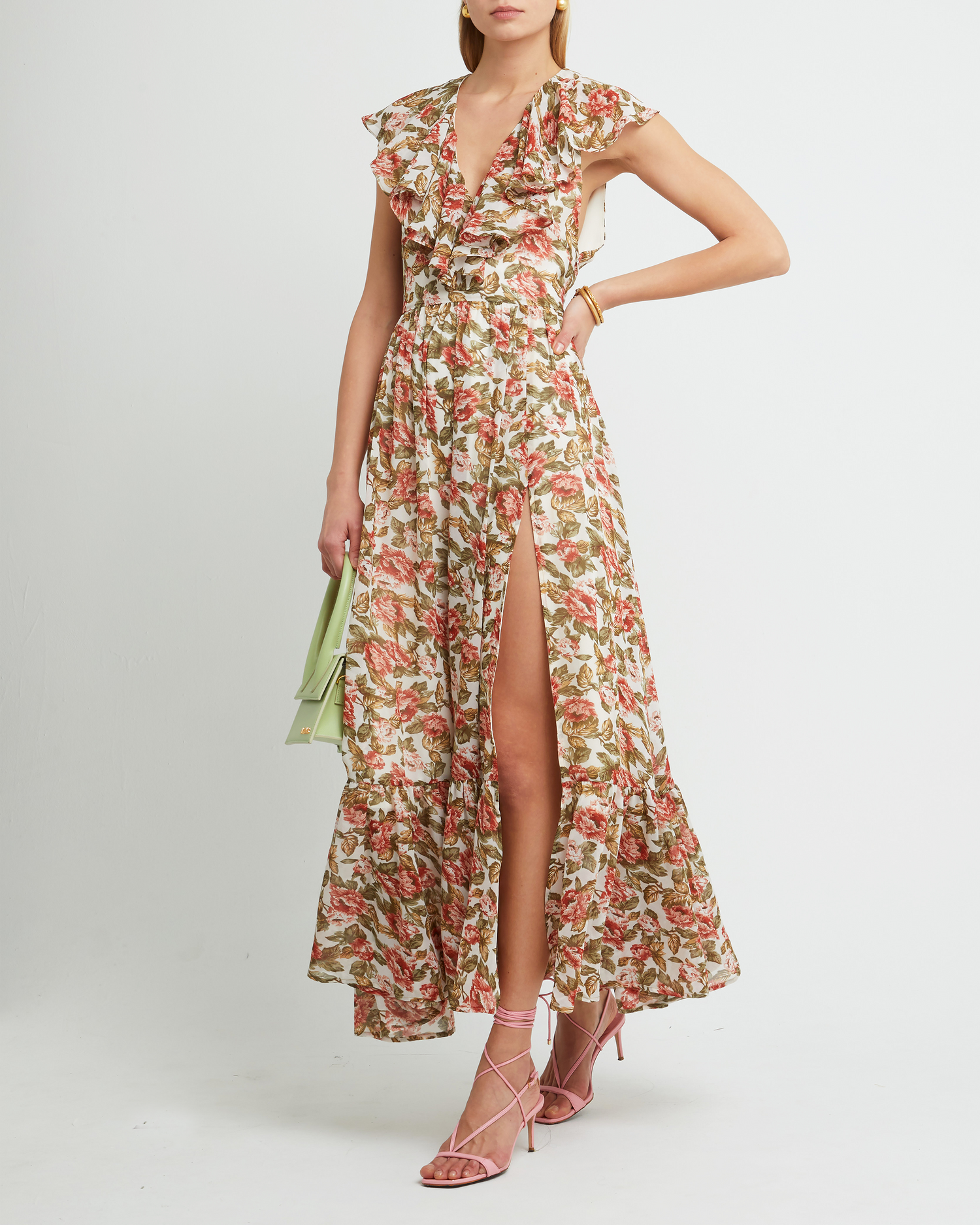 First image of Shea Maxi Dress, a floral wedding guest dress with high side slit, flutter ruffle sleeves, v-neckline, tiered skirt, cinched waistline, side zipper, and lining