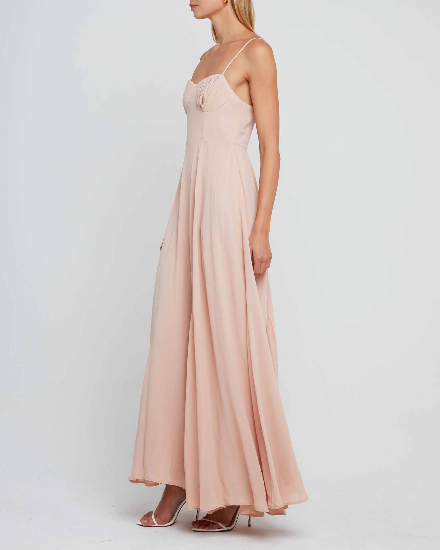 Third image of Winslow Dress, a pink bridesmaid dress with pleated cup detail, bustier style bodice, long flowy skirt, side slit, back zipper, adjustable straps, lining, and sweetheart neckline