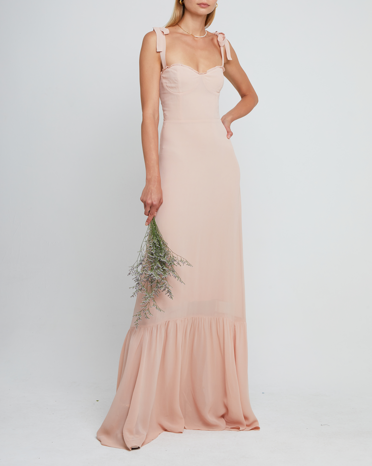 Fourth image of La Rue Dress, a pink floor-length bridesmaid dress with adjustable tie straps, cup detail, neckline ruffles, tiered skirt, lining, back smocking and back zipper