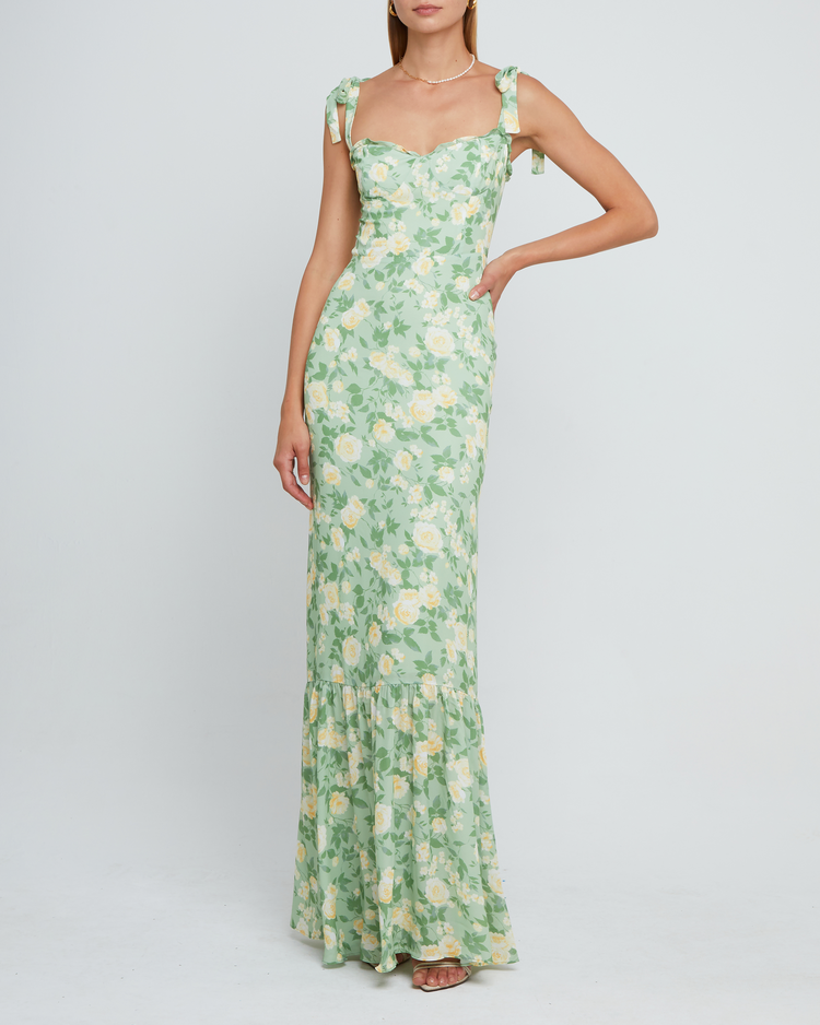 Seventh image of La Rue Dress, a sage floral floor-length bridesmaid dress with adjustable tie straps, cup detail, neckline ruffles, tiered skirt, lining, back smocking and back zipper