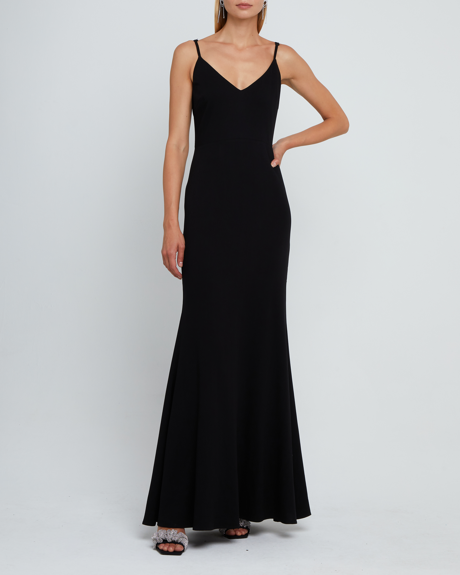 First image of Balsam Dress, a black bridesmaid dress with deep v-neckline, adjustable straps, back zipper, low scoop back, and long skirt