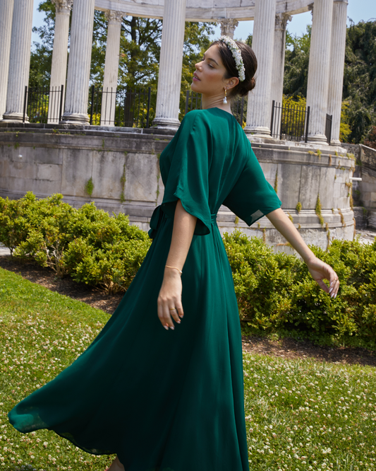 Second image of Artie Dress, a green long maxi wrap style bridesmaid dress with flutter sleeves, v-neckline, adjustable waist tie, lining, and dart detail on bodice