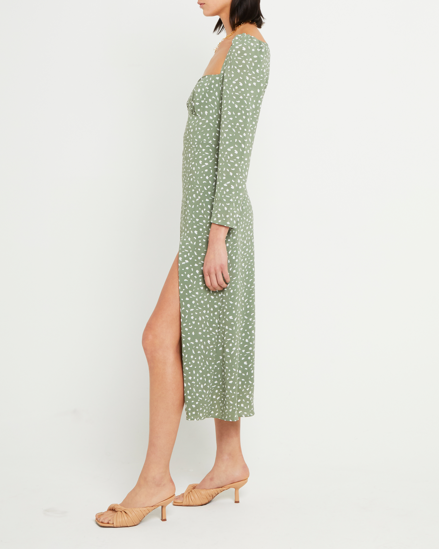 Third image of Crimini Dress, a green midi dress, sweetheart neckline, floral, long sleeves, fitted