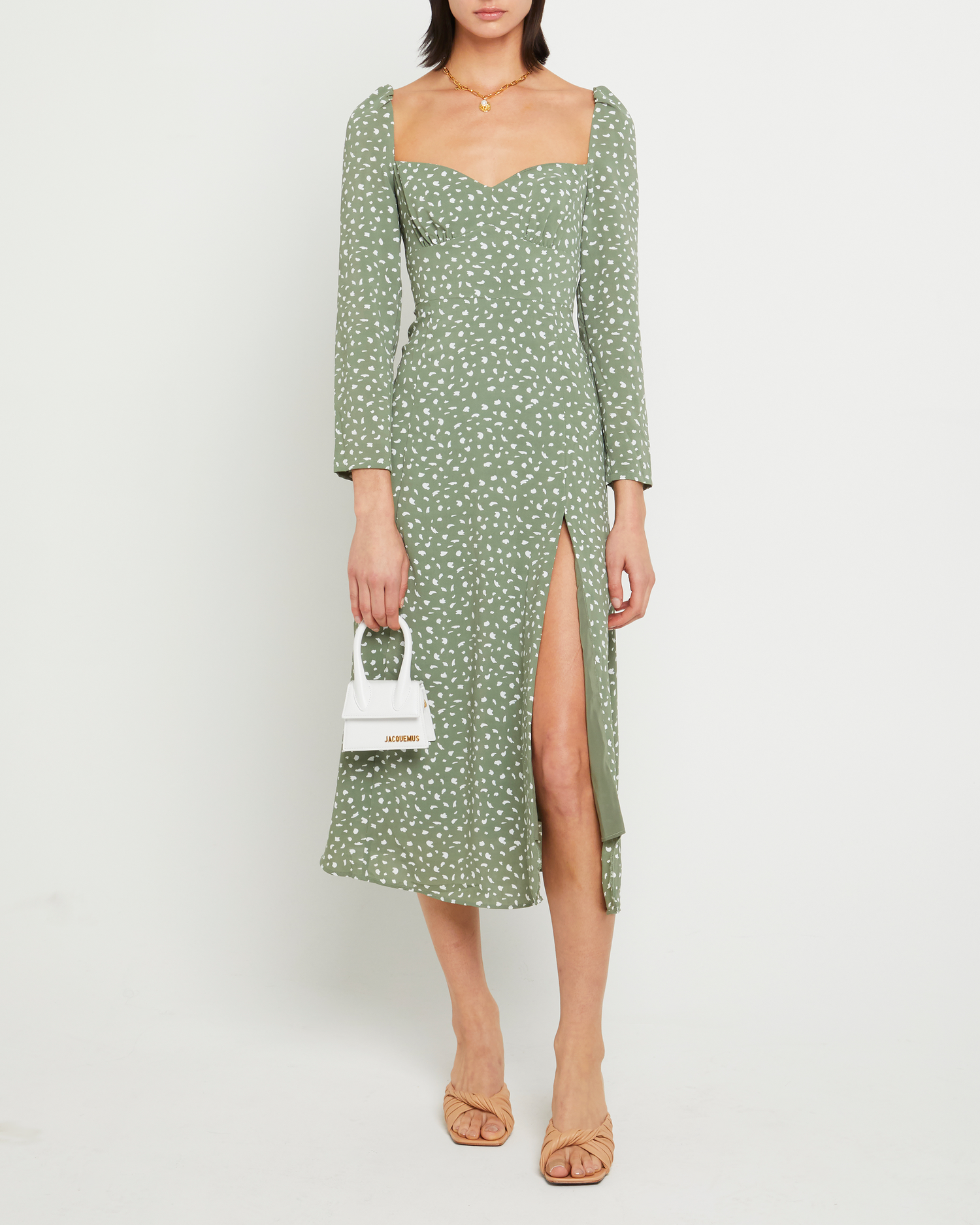 First image of Crimini Dress, a green midi dress, sweetheart neckline, floral, long sleeves, fitted