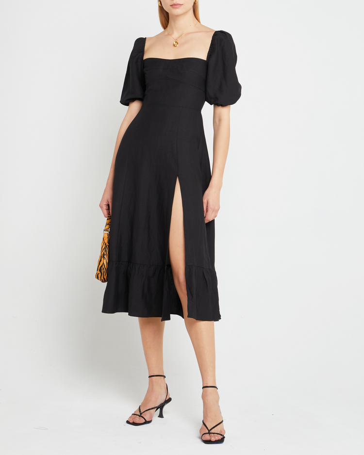 Fifth image of Violetta Midi Dress, a black midi dress, sweetheart neckline, short sleeves, puff sleeves, side slit