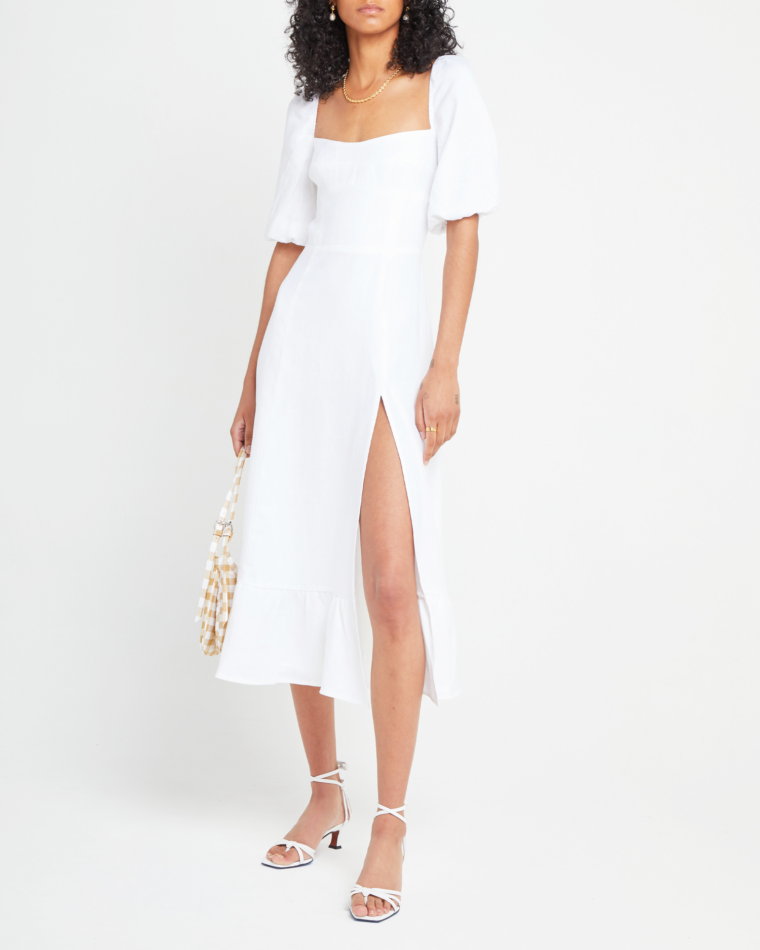 Third image of Violetta Midi Dress, a white midi dress, sweetheart neckline, short sleeves, puff sleeves, side slit